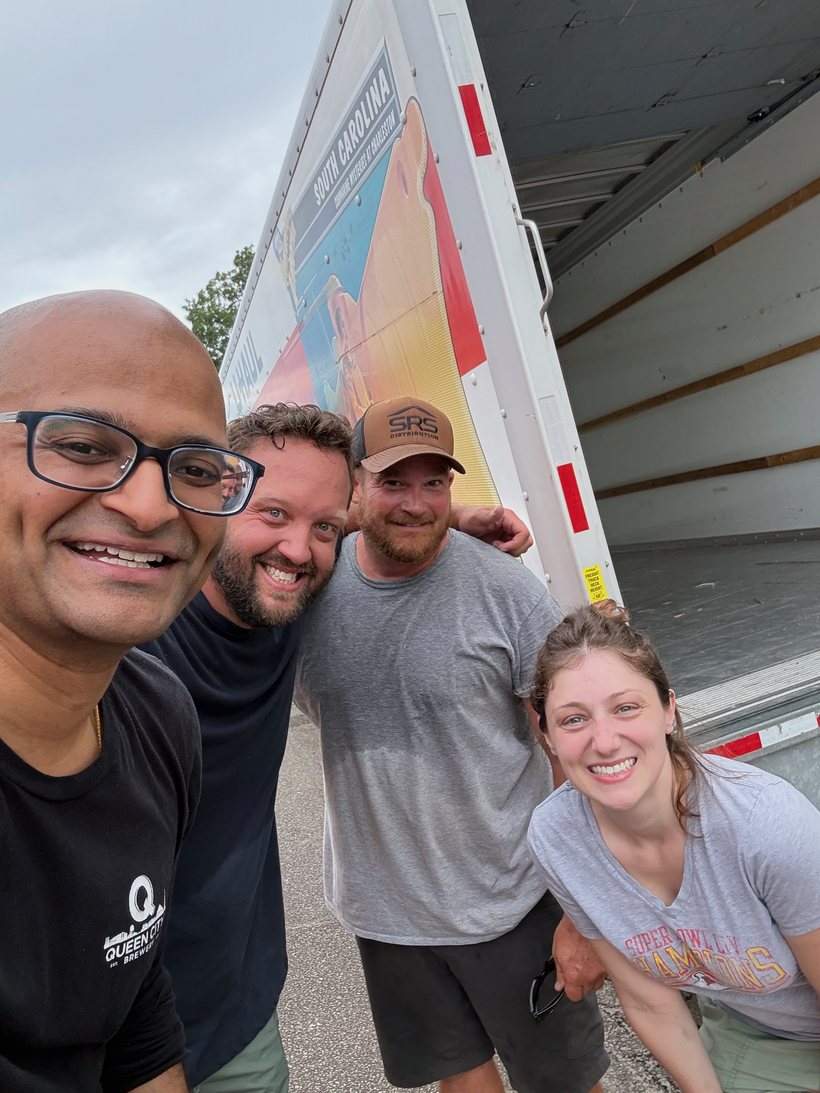 The Reedy Moving Co crew with their first customers in front of the moving truck